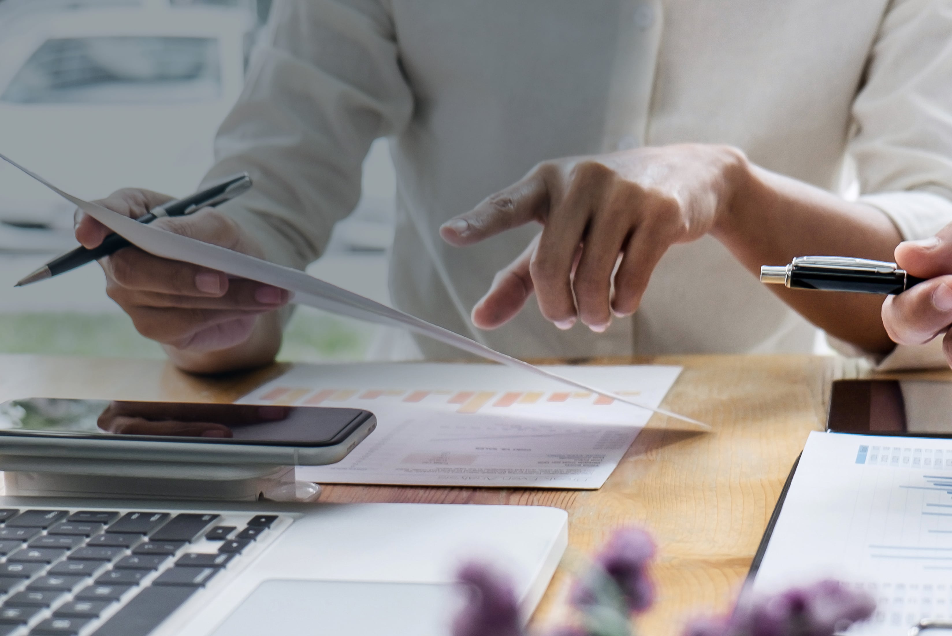 Busy hands working on paperwork