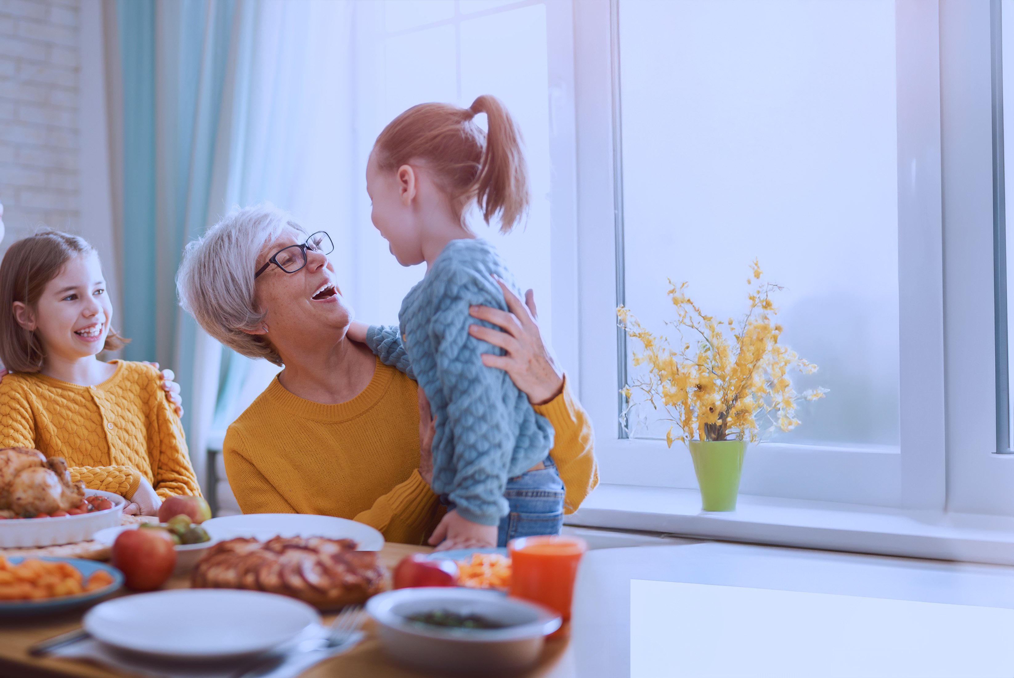 grandmother with grandkids at holiday dinner